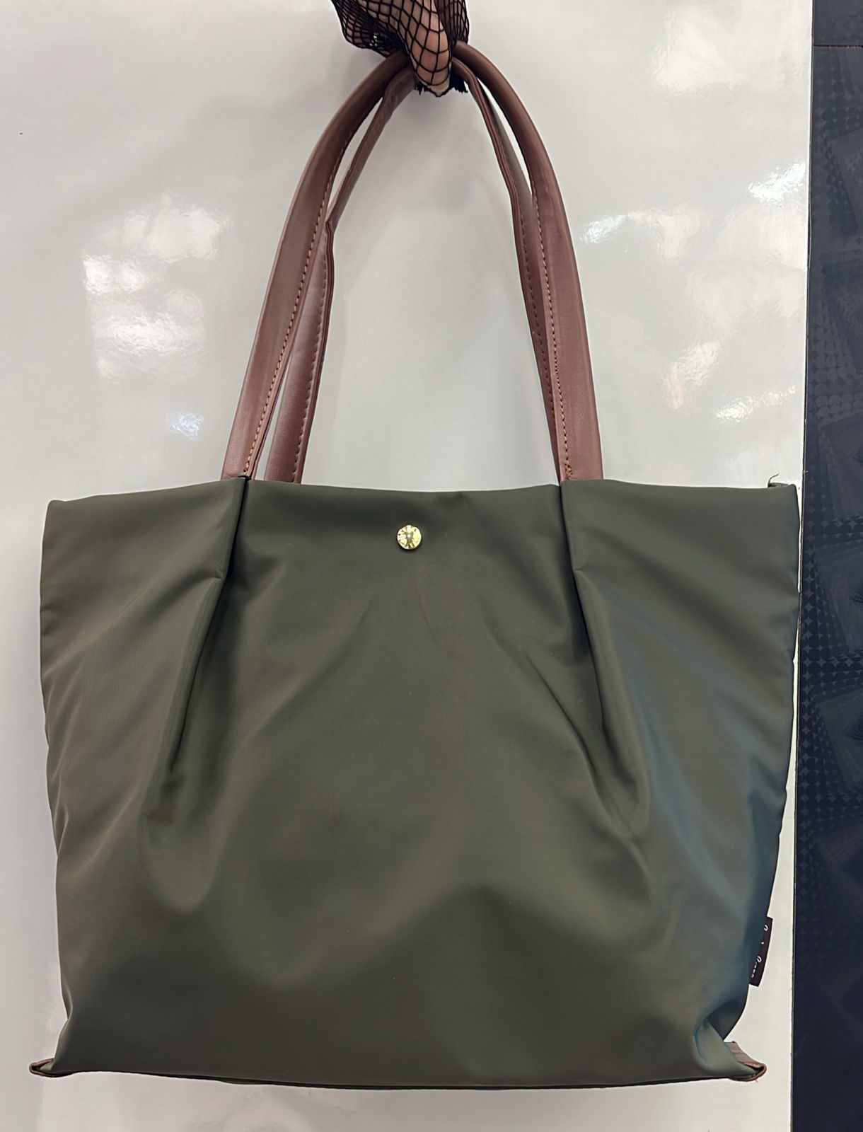 Tote bag with cushioned handles for shoulder comfort